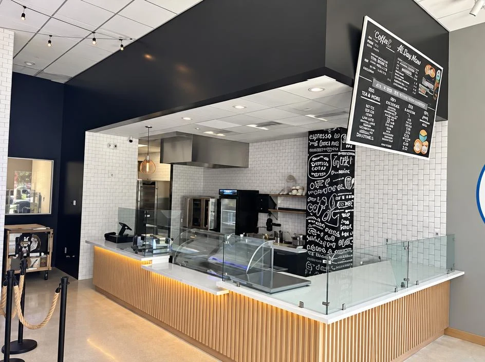Baked Bear — finished serving counter with the menu board beyond