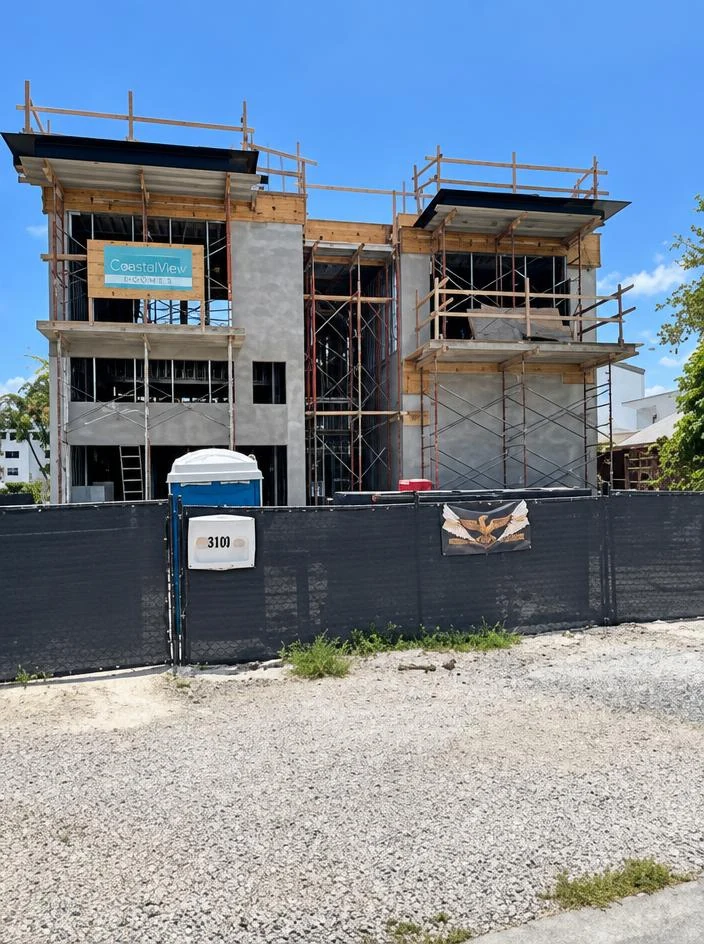 Custom Home — exterior under construction with scaffolding